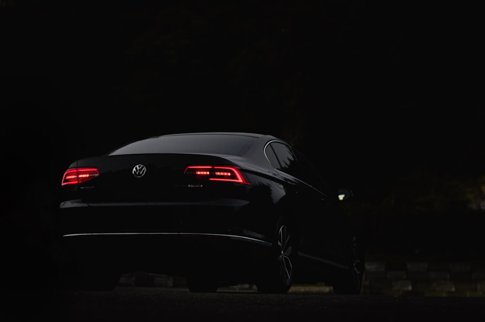 black porsche 911 parked on road during nighttime