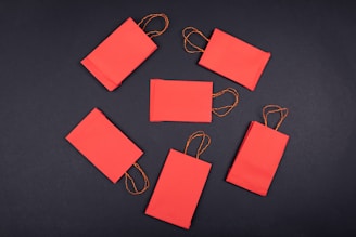 orange paper clip on black surface