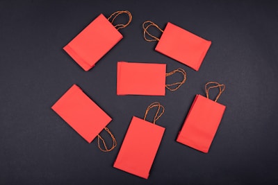 orange paper clip on black surface