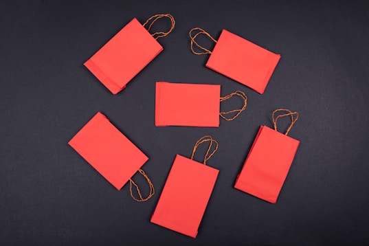 orange paper clip on black surface