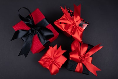 red ribbon on black textile presents google meet background