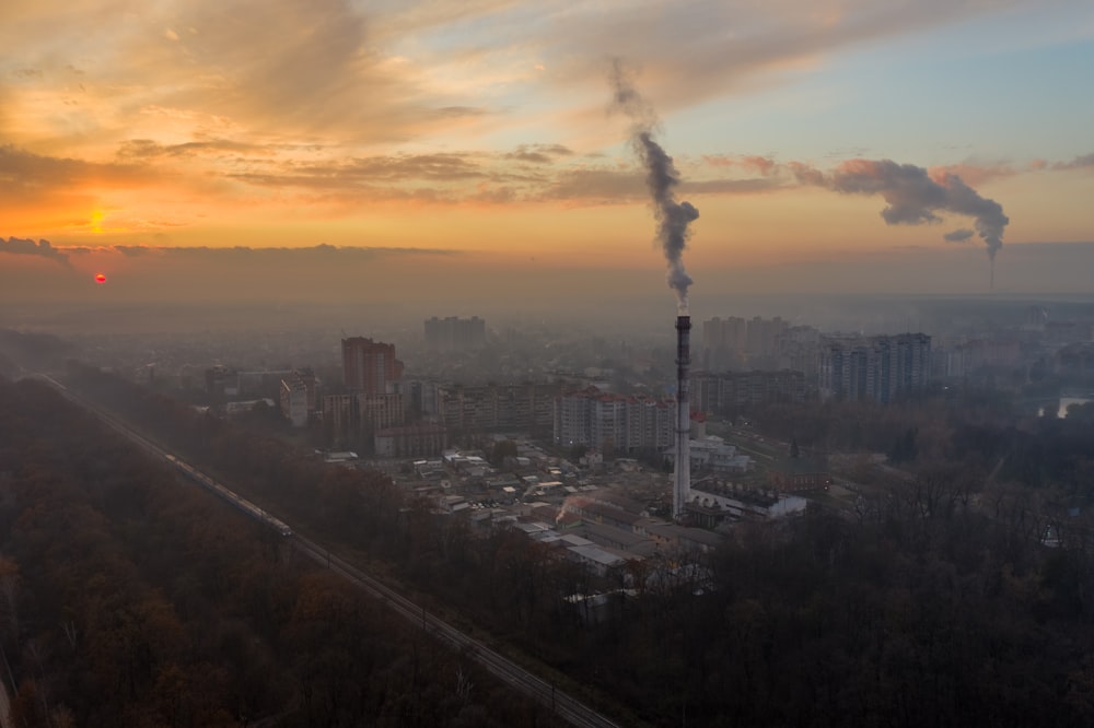 city with high rise buildings under white clouds during daytime