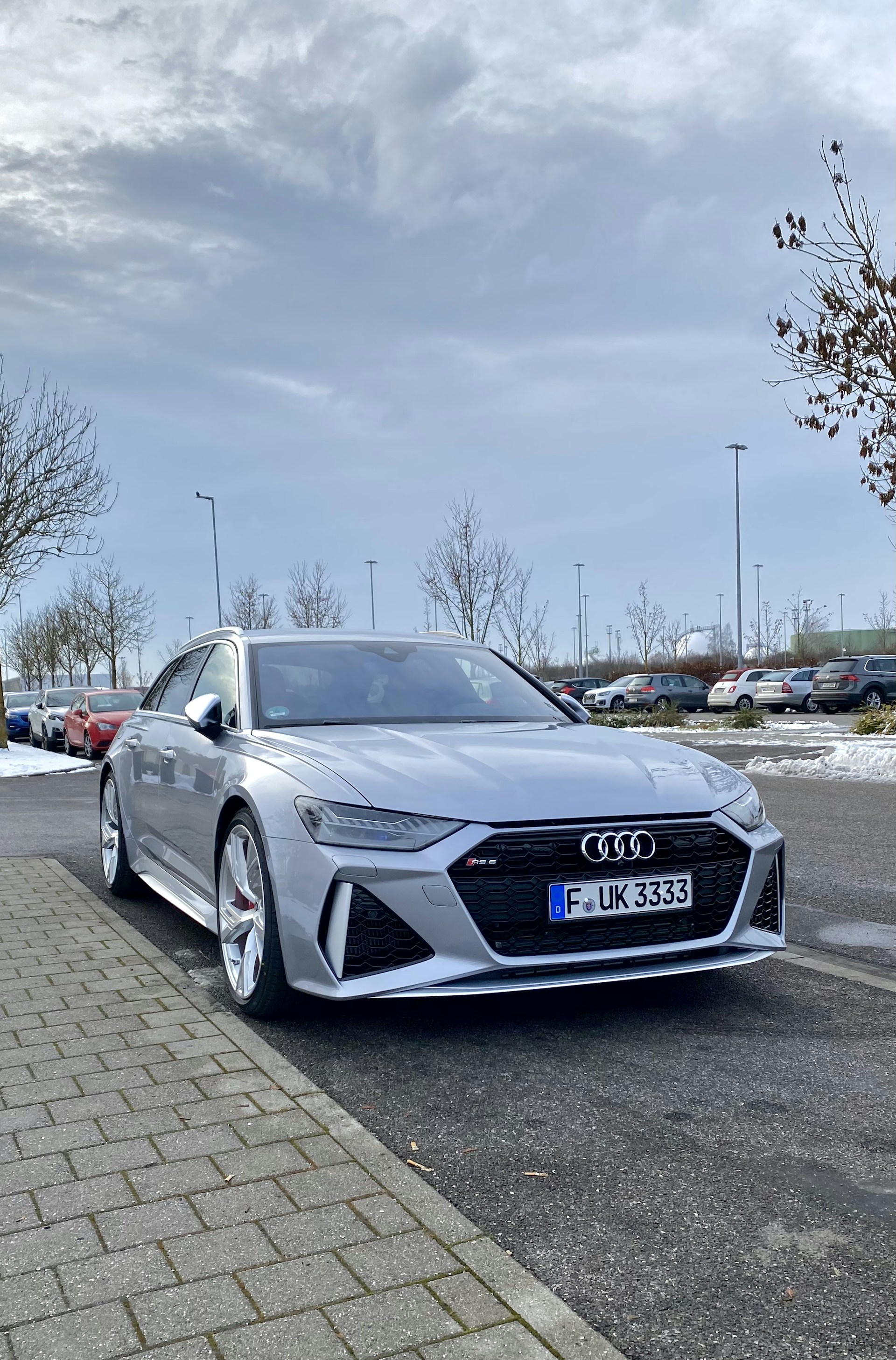 black audi coupe parked on parking lot during daytime