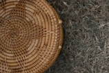 Close-up of a finely woven bamboo basket with soft sunlight highlighting its texture.