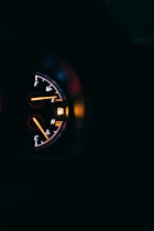 black and red analog speedometer