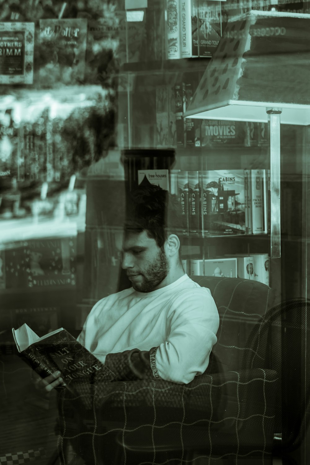 man in white dress shirt sitting on chair