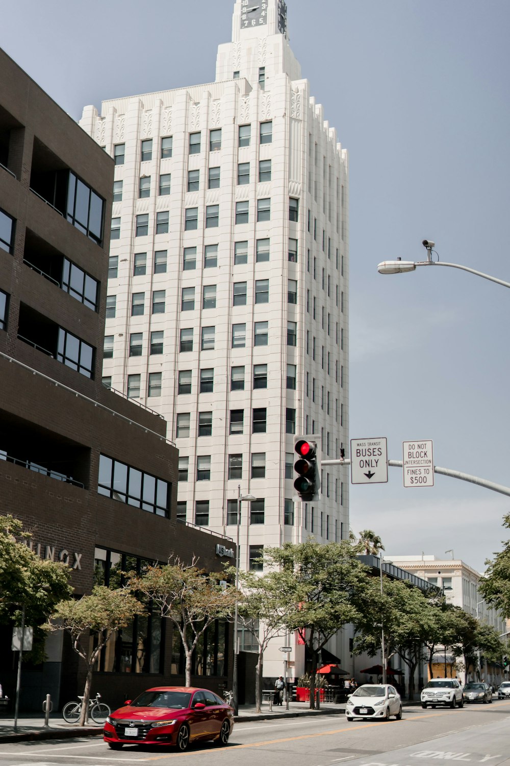 white concrete building near traffic light during daytime