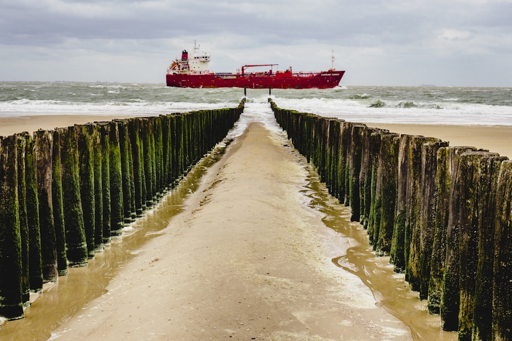 brown wooden dock on sea during daytime