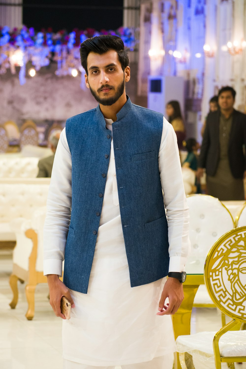 man in blue scarf and white blazer