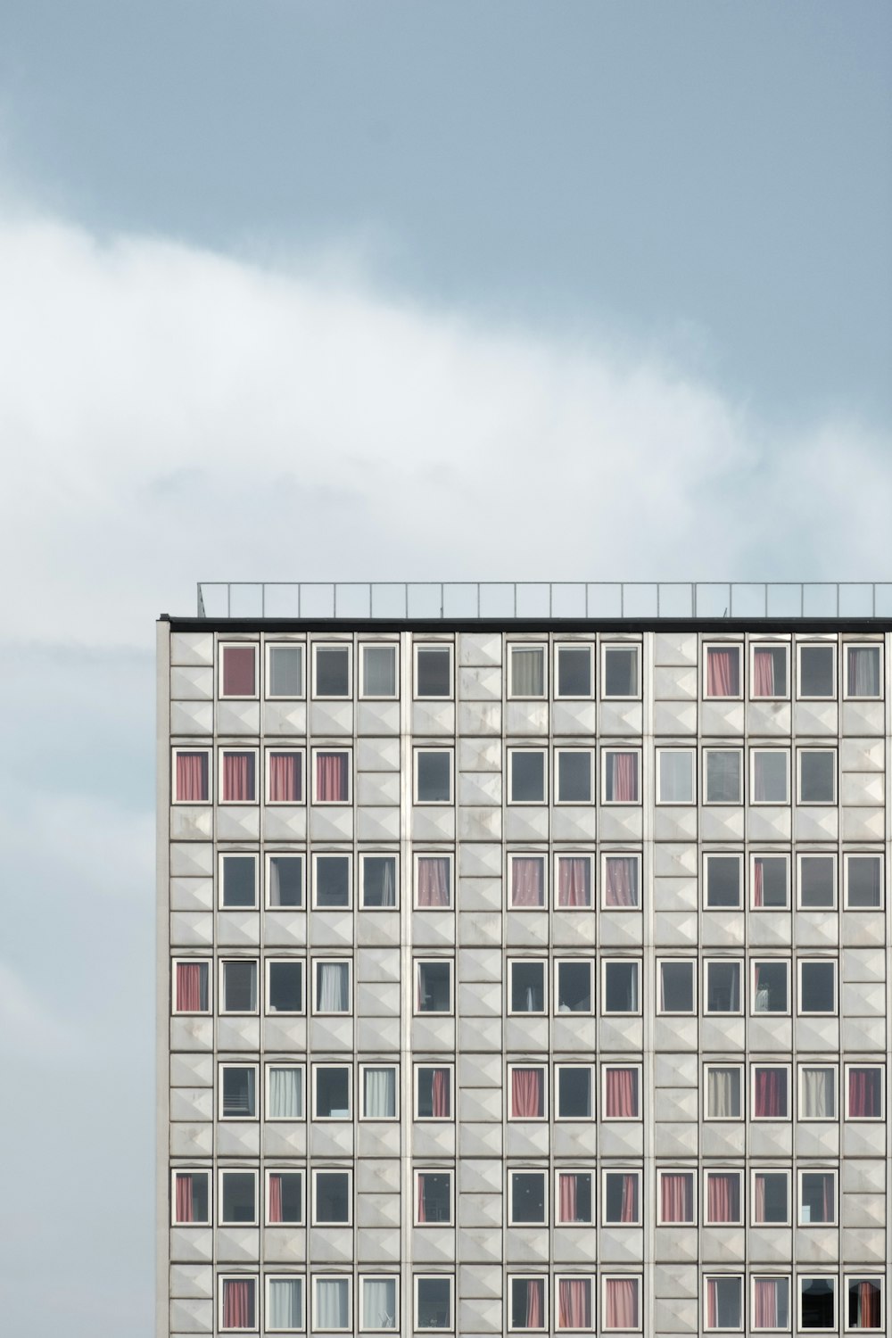 white concrete building under blue sky during daytime