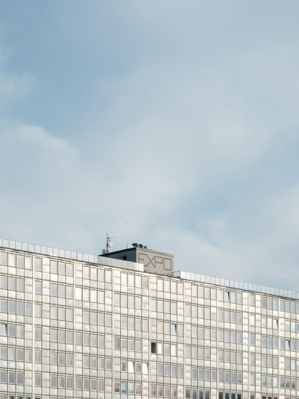 white concrete building under blue sky during daytime