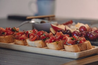 sliced strawberries on bread on white ceramic plate