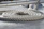 Close-up of thick marine ropes coiled neatly on a fishing boat deck.