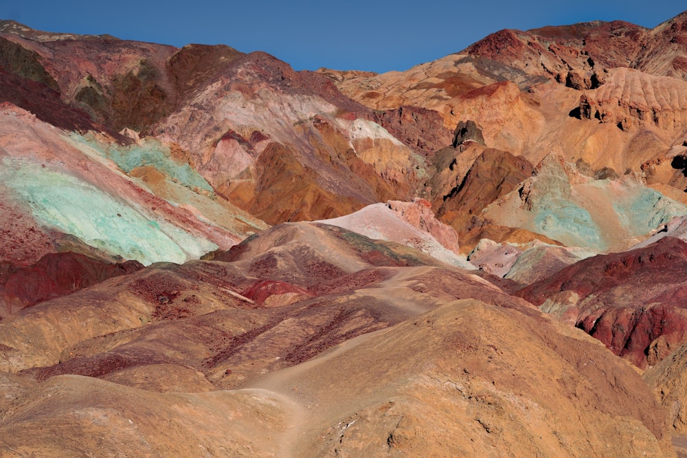 brown and gray mountains under blue sky during daytime