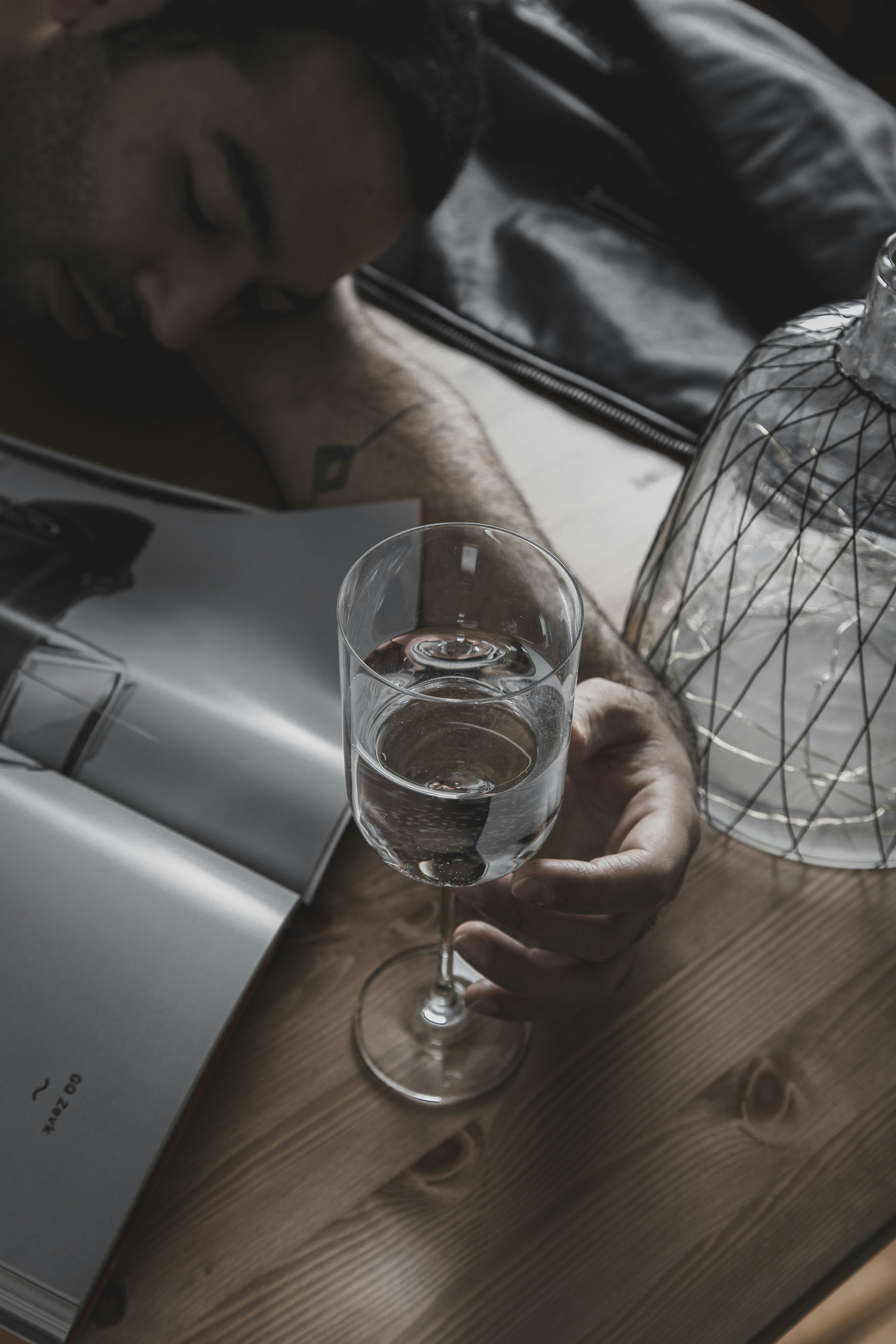 clear drinking glass on brown wooden table