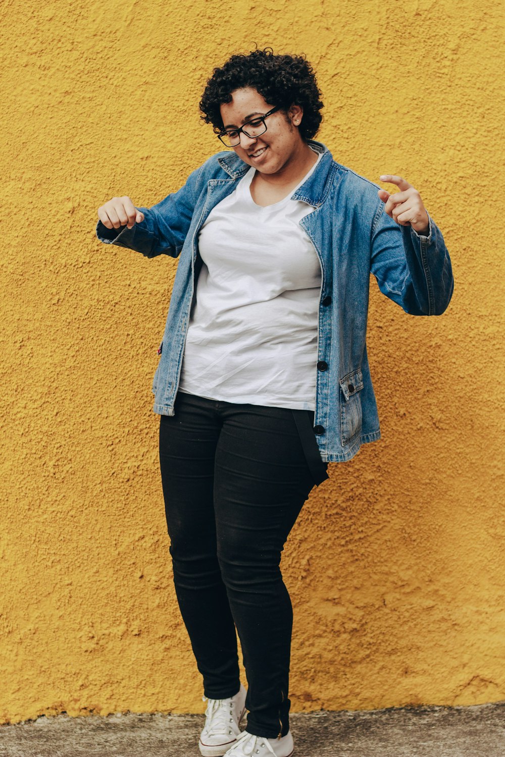 woman in blue cardigan and white shirt