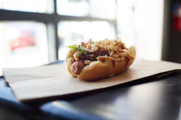 Hot dog loaded with crispy fried onions