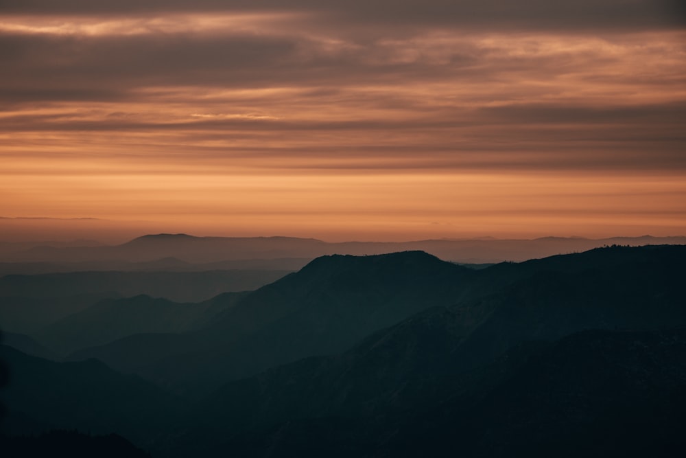 silhouette of mountains during sunset