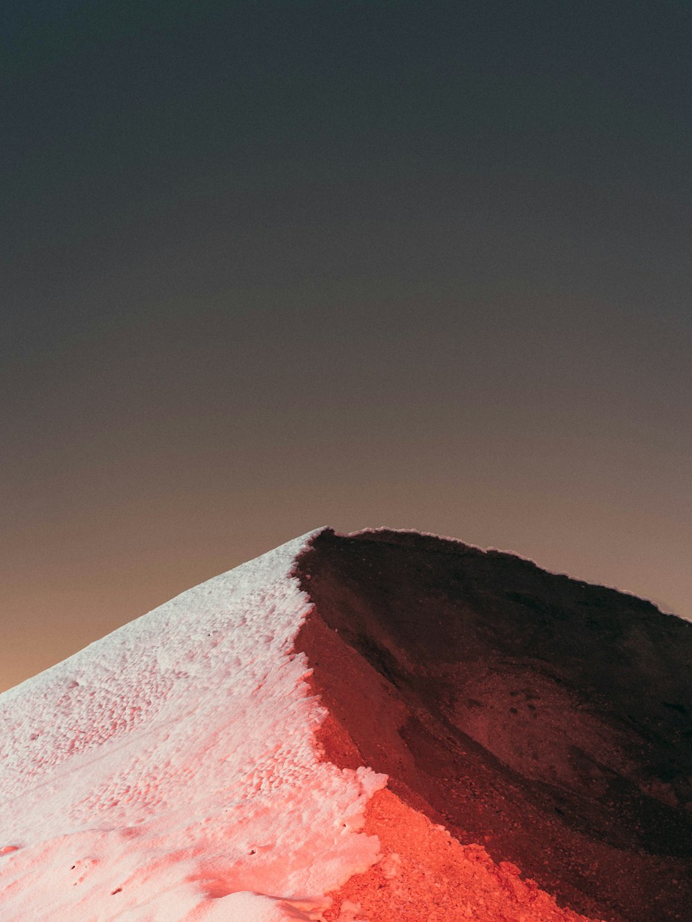 snow covered mountain under blue sky during daytime