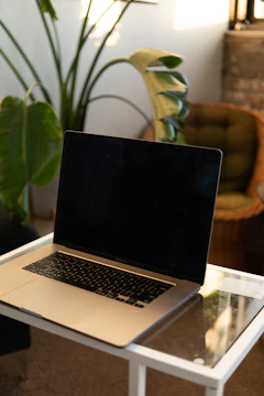 Technician repairing a laptop screen in a cozy home office