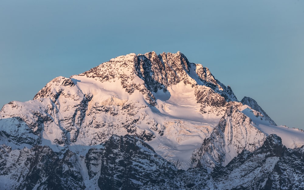 snow covered mountain under blue sky during daytime