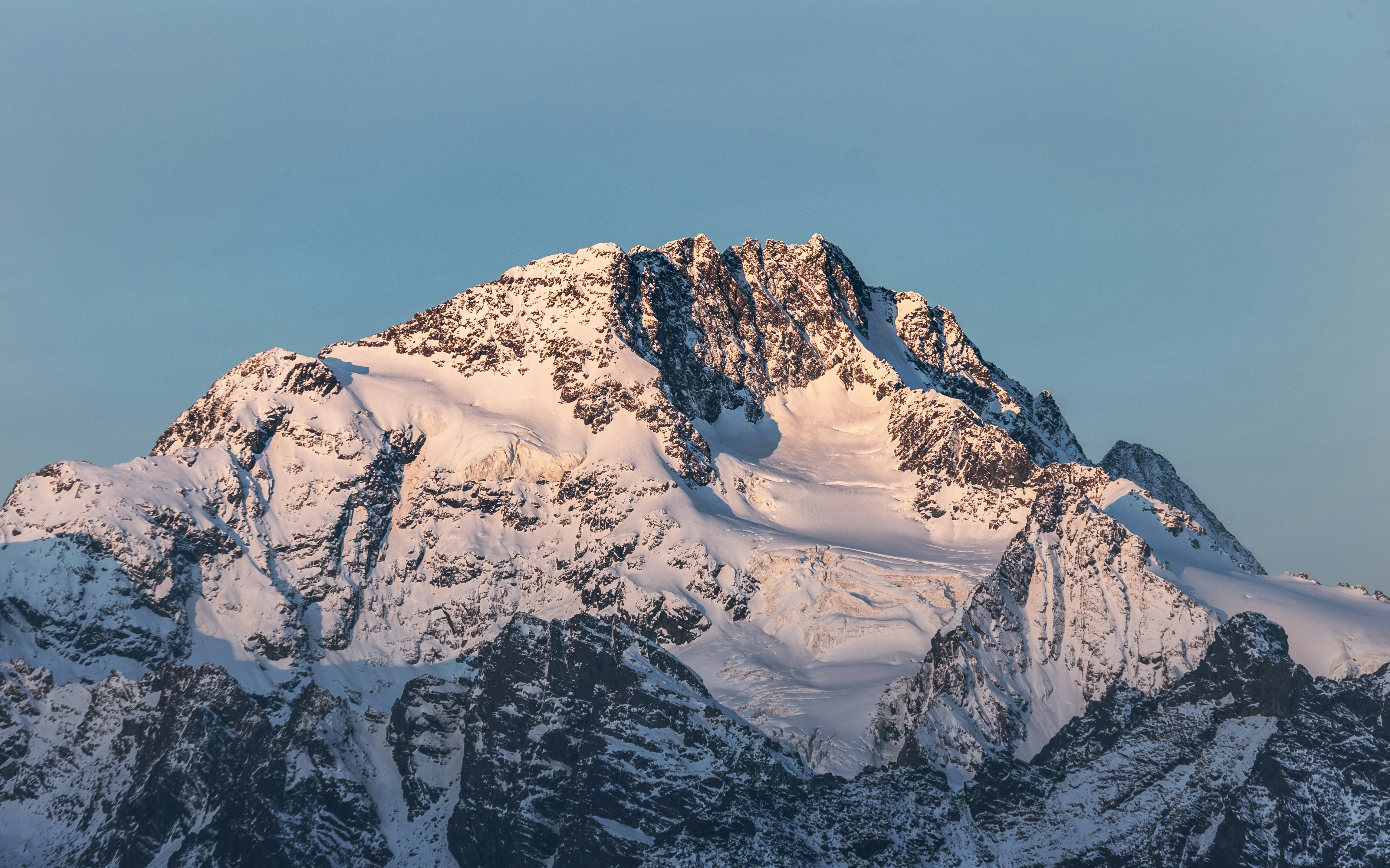 snow covered mountain under blue sky during daytime