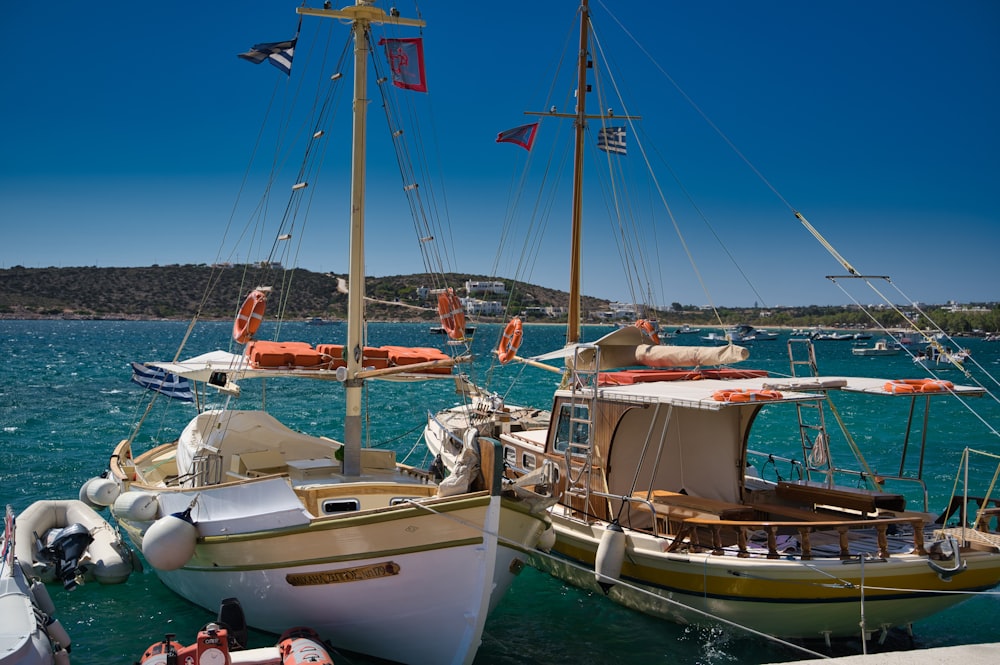 white and brown boat on sea during daytime