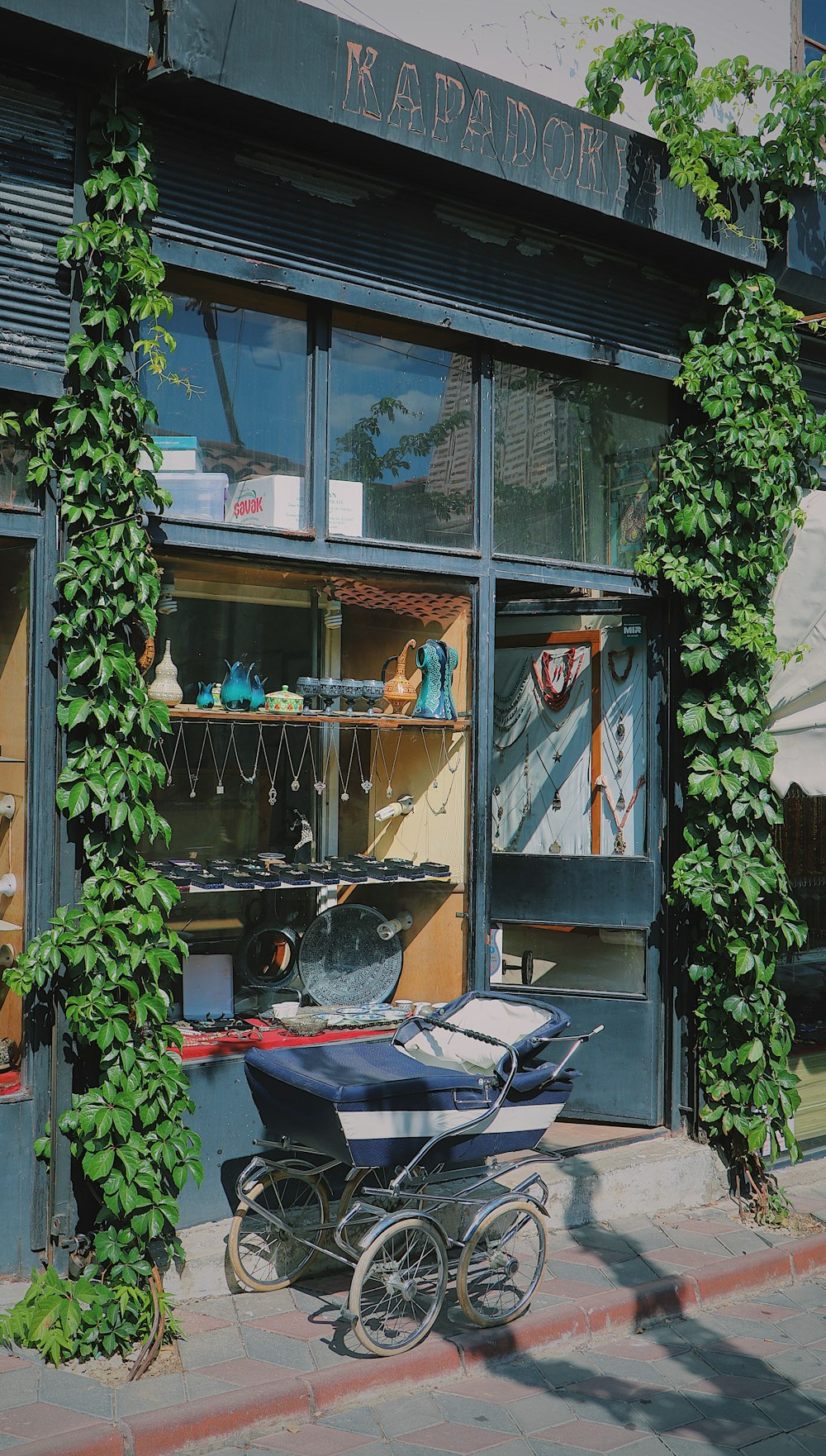 black car parked in front of store