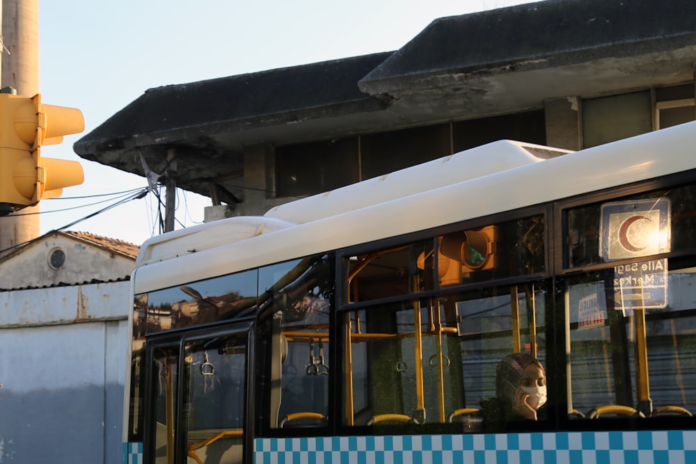 yellow and black bus under white clouds during daytime