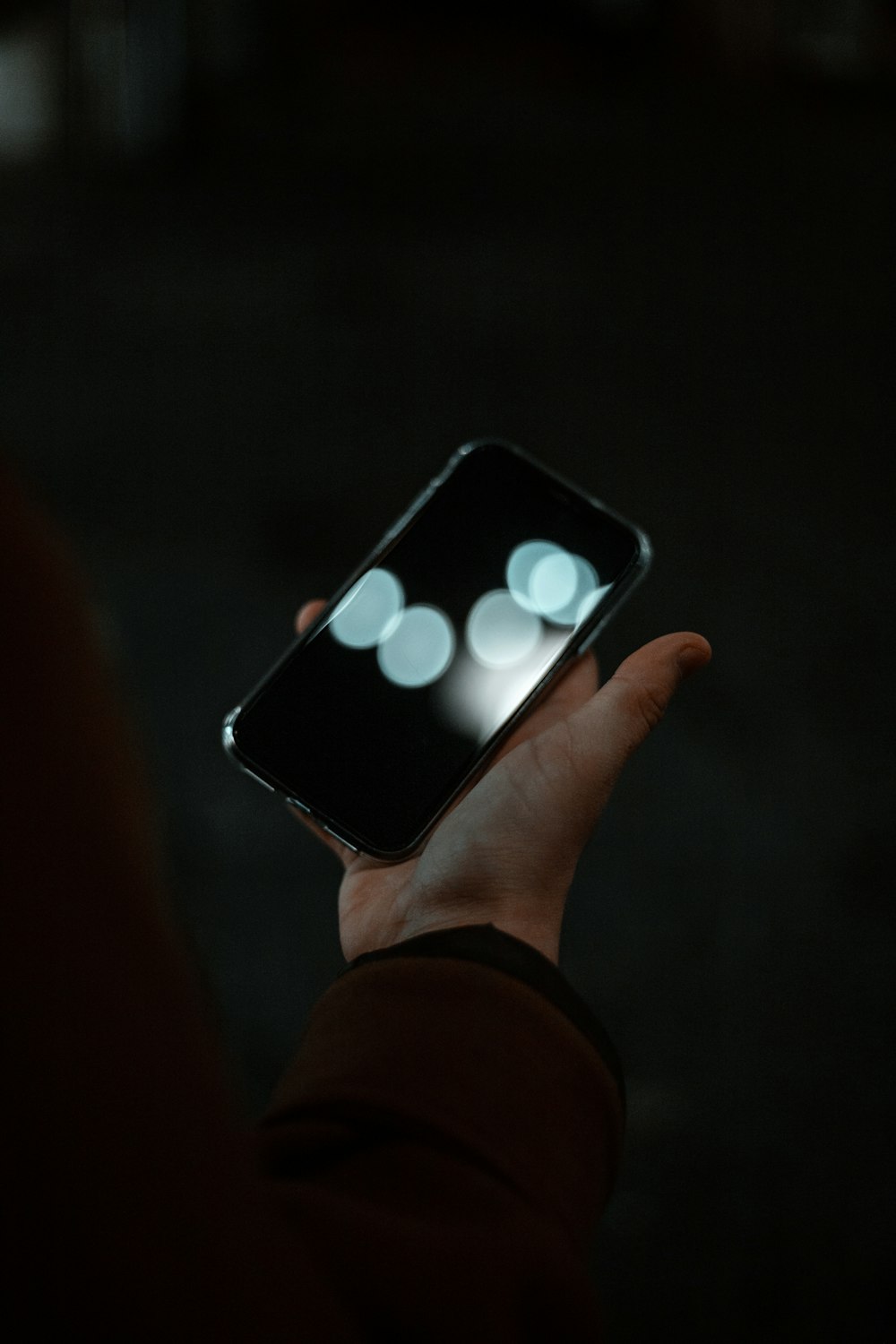 person holding black iphone 5