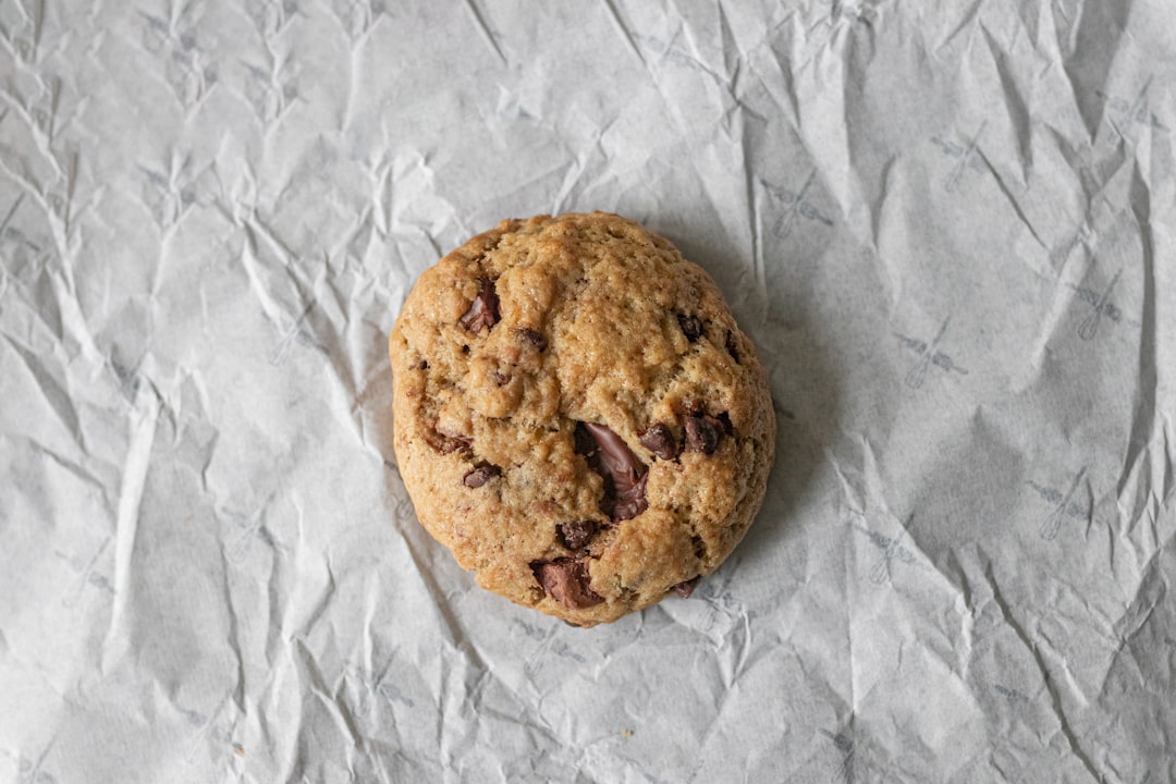brown cookie on white textile, Chocolate chip cookie - white blackground