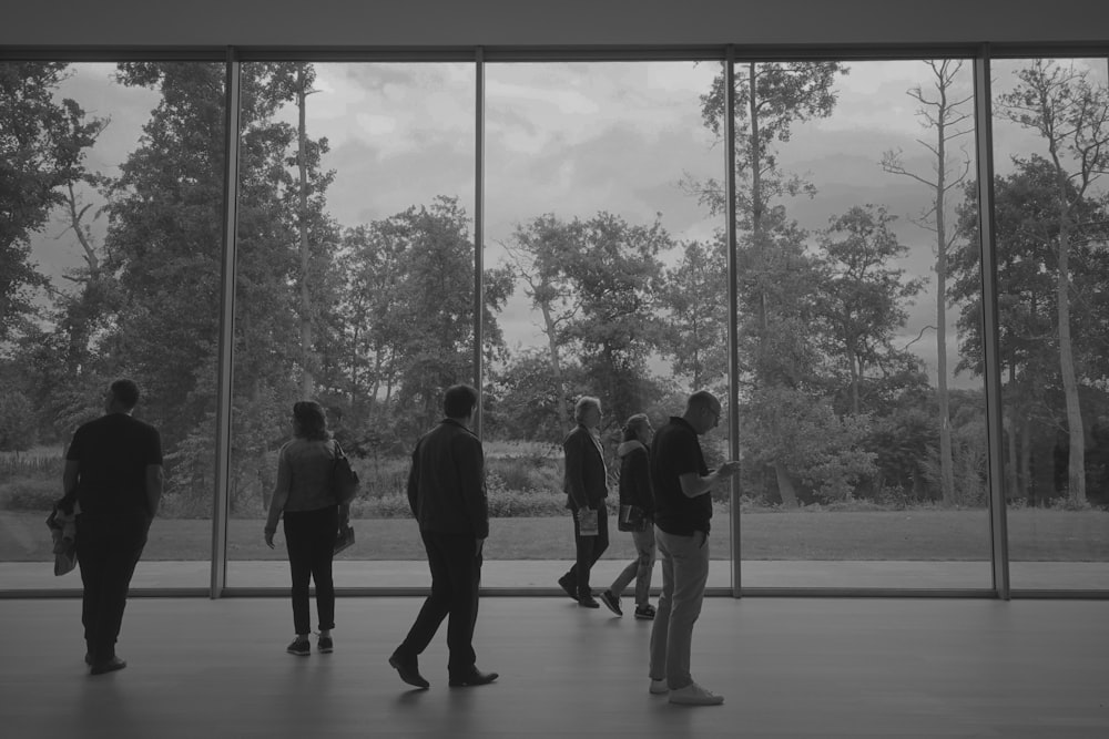 silhouette of 3 men standing on the ground