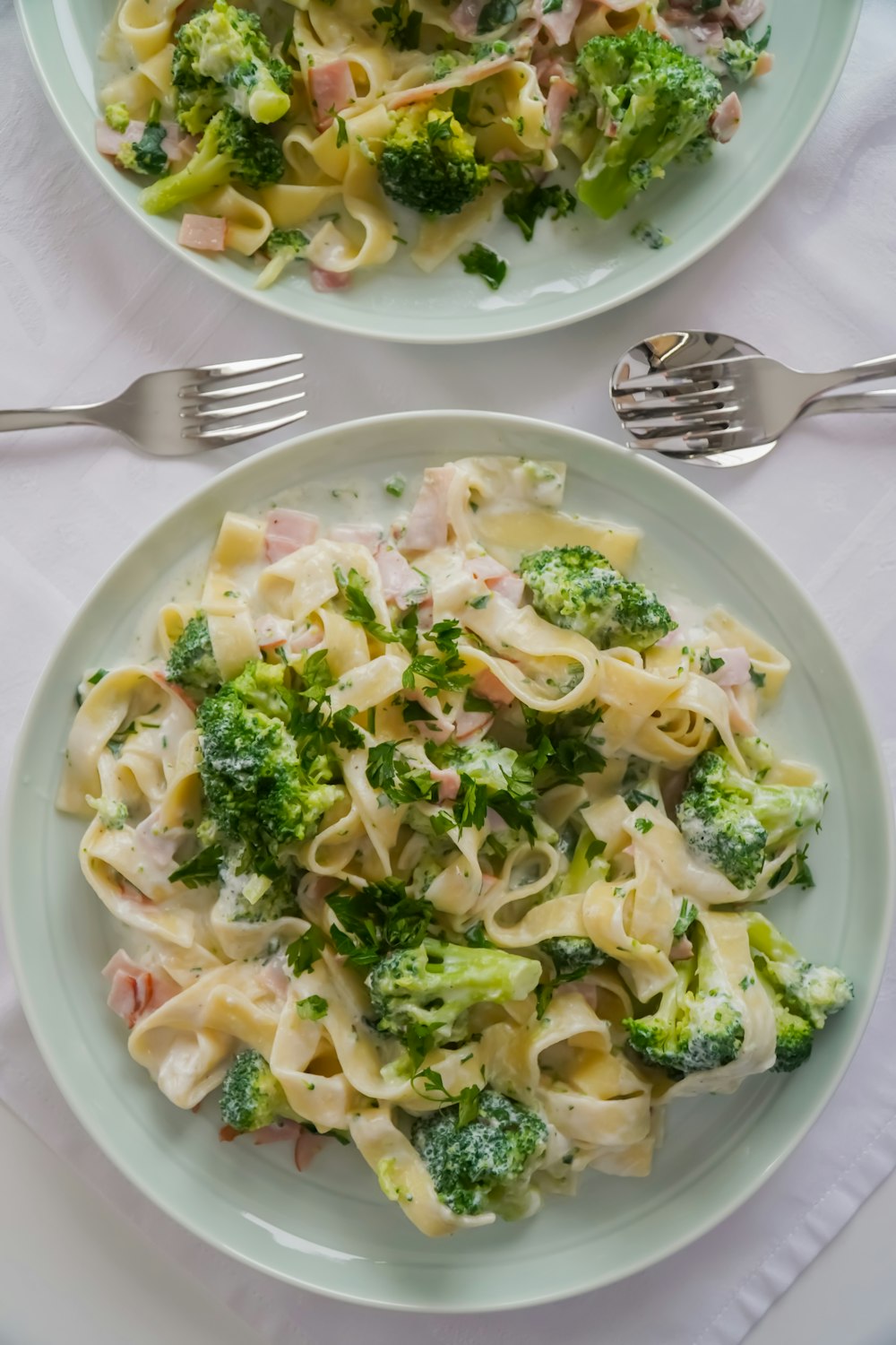 white ceramic plate with pasta dish