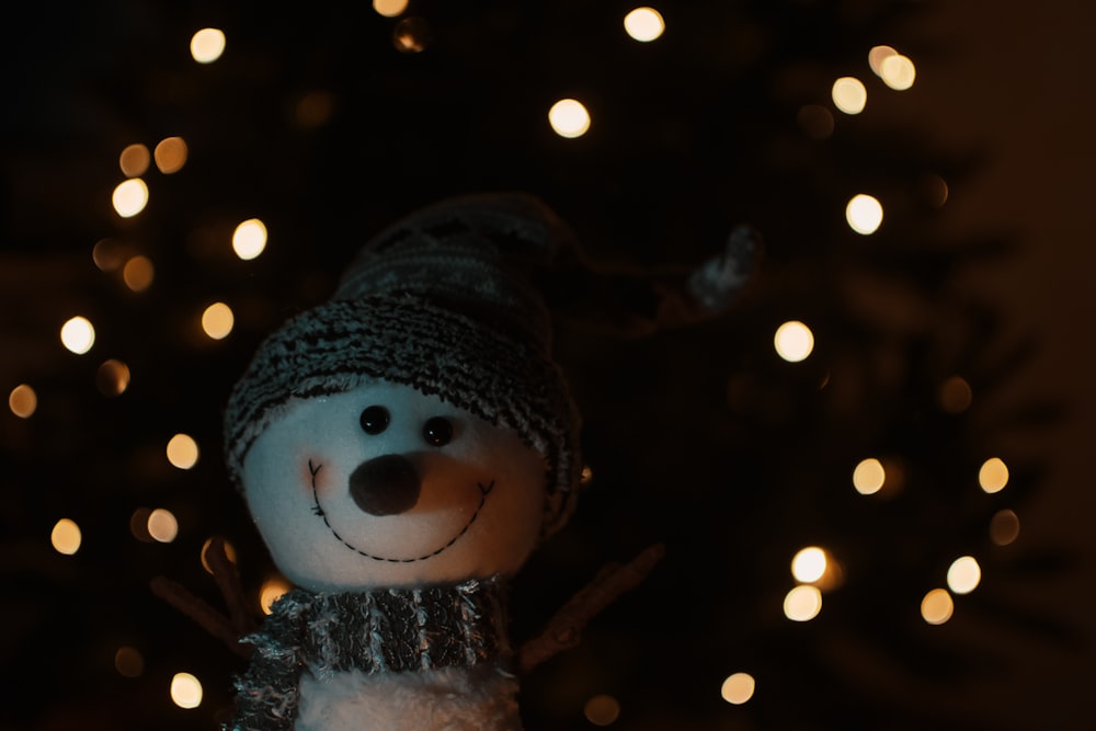 snowman with black knit cap