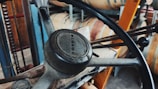 A close-up of a forklift's control panel and steering wheel.