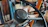 Close-up of a Toyota gearbox with Daud Auto Parts warehouse shelves in the background.