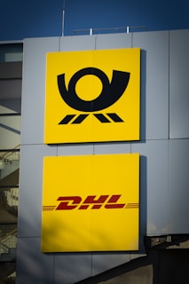 yellow and black no smoking sign DHL
