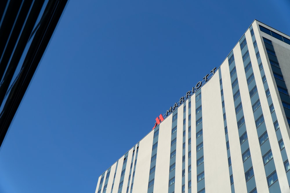 white and blue concrete building under blue sky during daytime