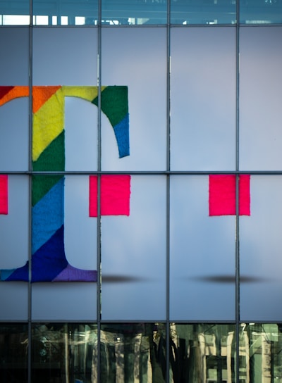 white blue red and yellow glass building