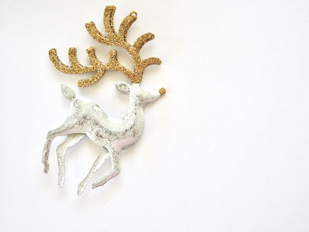 gold and white starfish on white surface