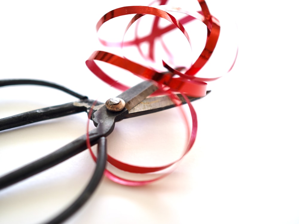 red and black wire with white background