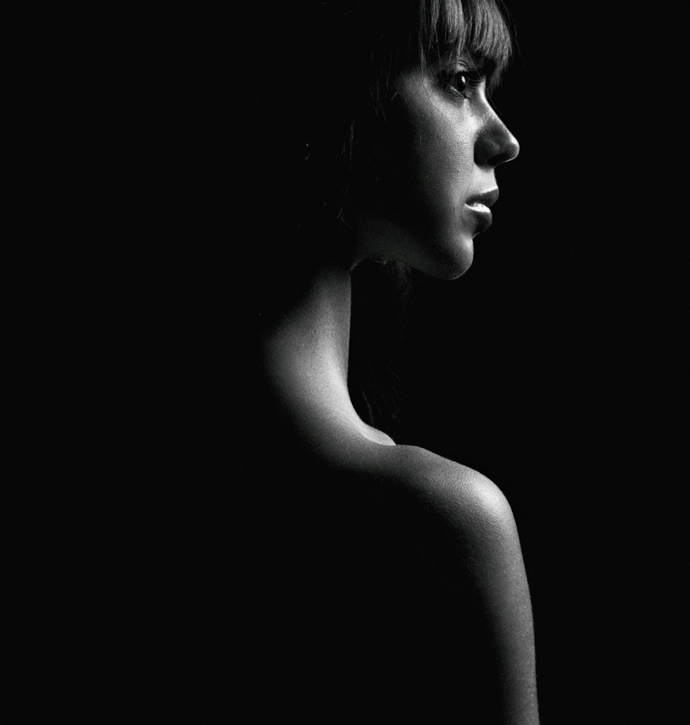 grayscale photo of womans face