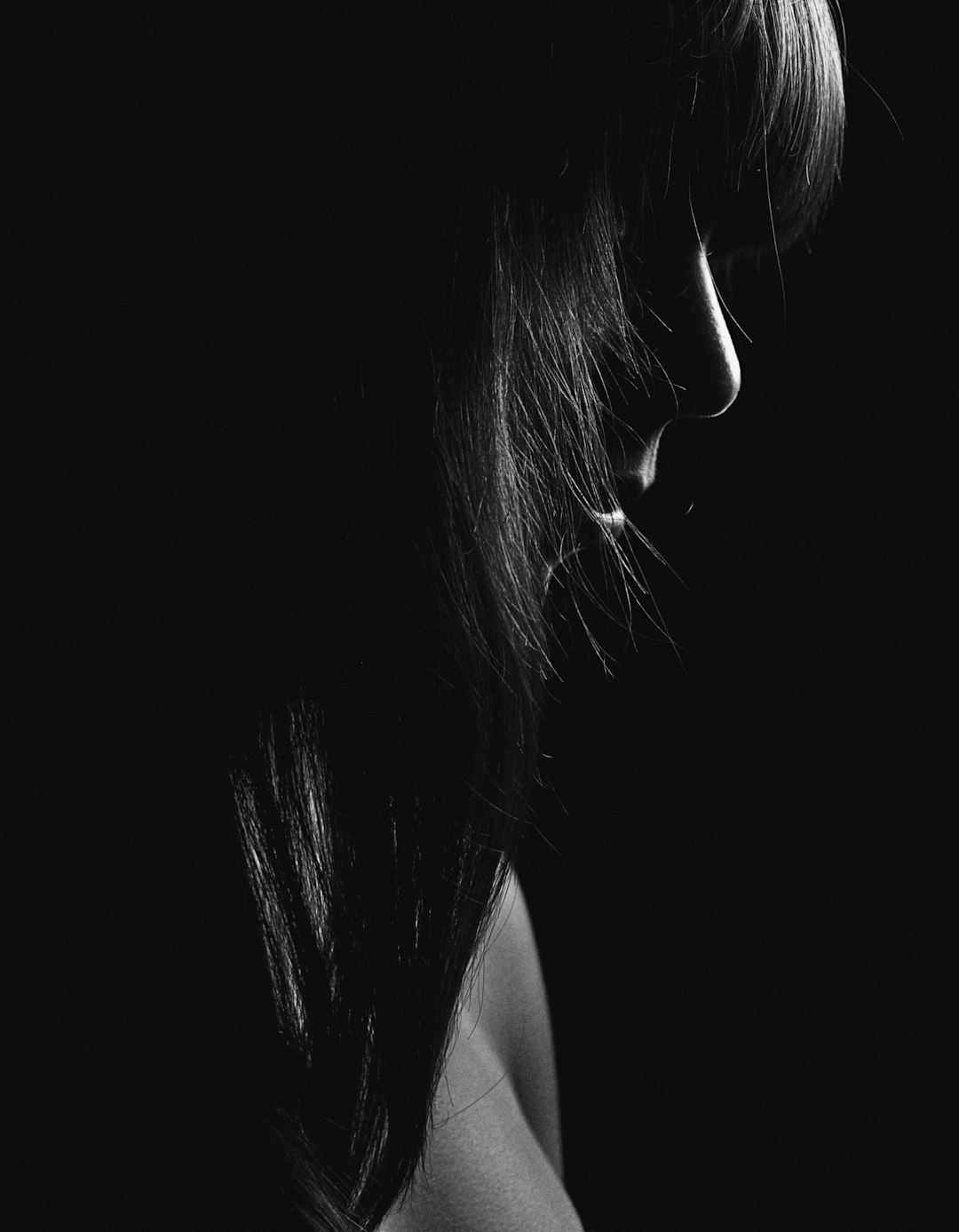 grayscale photo of womans face