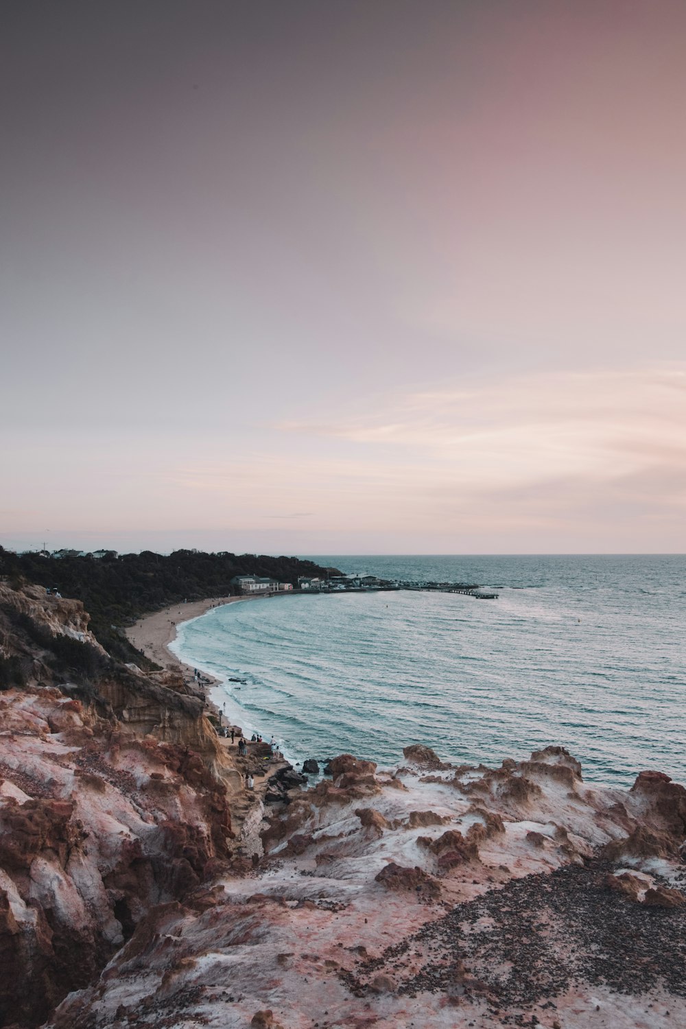 brown rocky shore under white sky during daytime