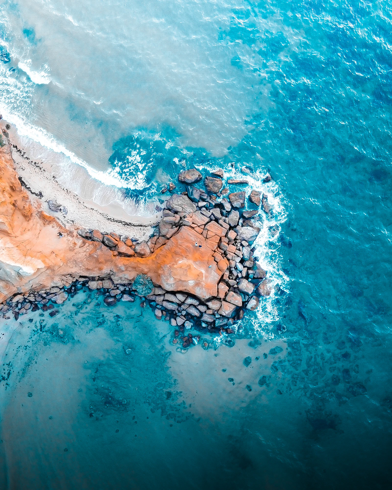 Ocean waves meeting a rugged coastline