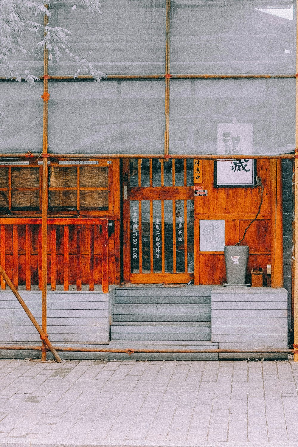 brown wooden door on gray concrete wall