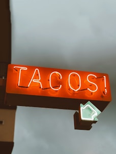 brown and white love neon light signage