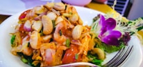 A vibrant dish showcasing colorful vegetables and herbs.
