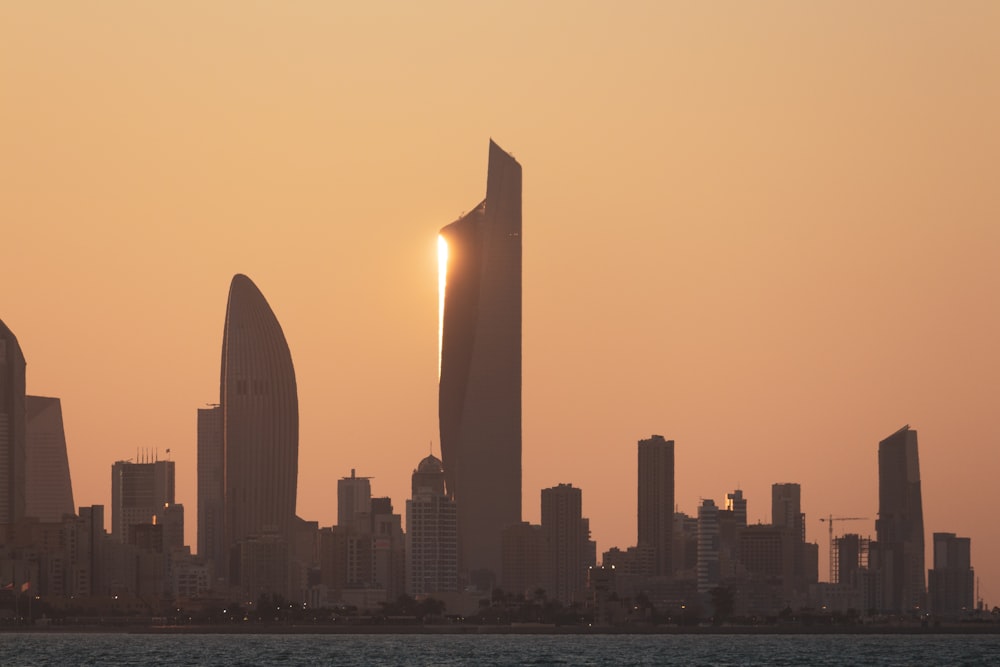 city skyline during sunset with city skyline in the distance