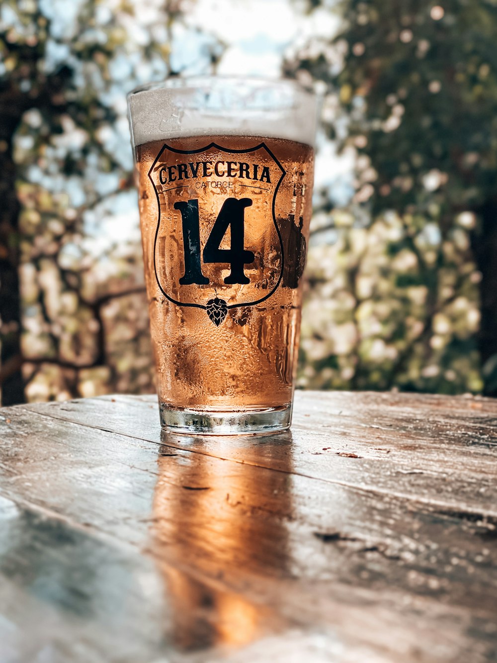 clear drinking glass on brown wooden table